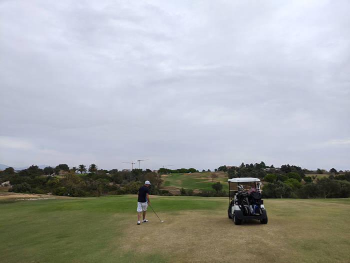 Hitting the second shot into the 8th green at Boavista golf club