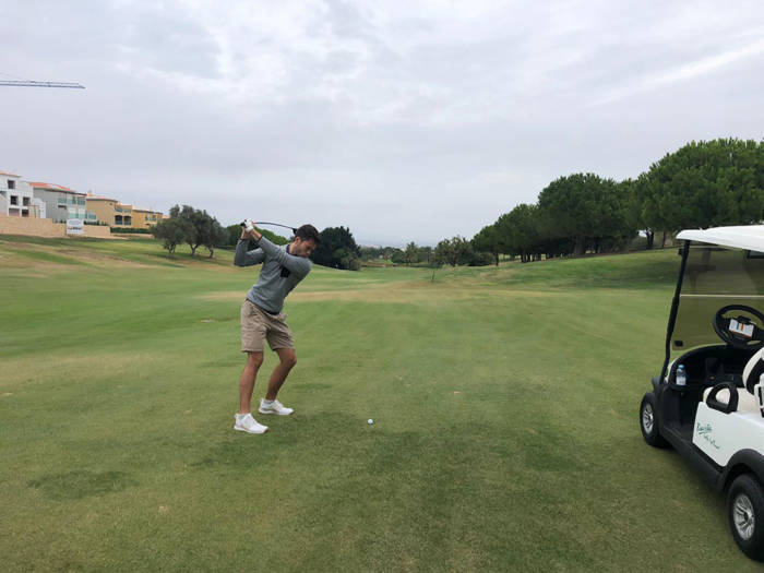 hitting a wood from the fairway trying to reach the green at boavista
