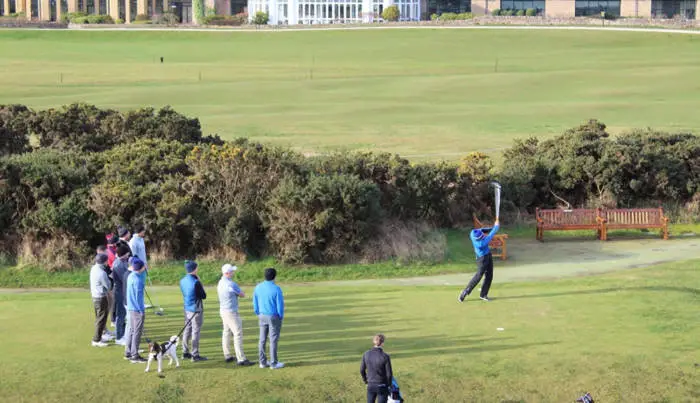 Group of golfers teeing off on the 1st tee at St Andrews Jubilee course