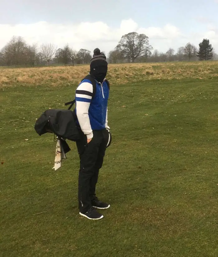 Golfer in winter wearing a lot of layers