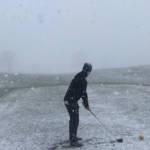 teeing off in the snow