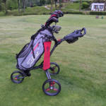 Side on view of the Motocaddy Cube golf trolley