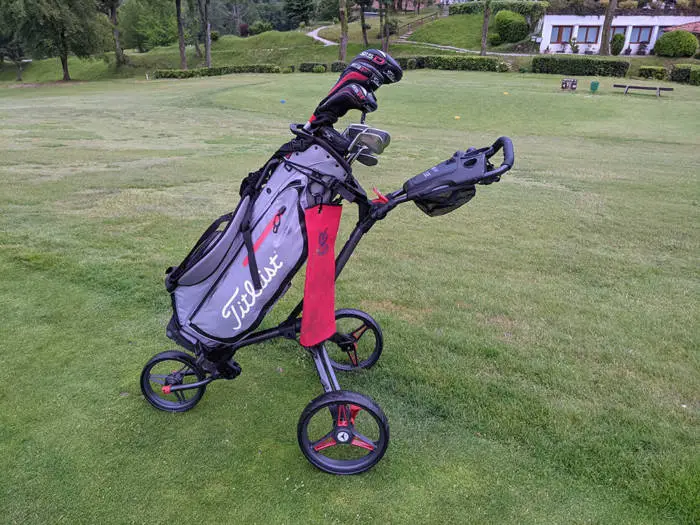 Side on view of the Motocaddy Cube golf trolley