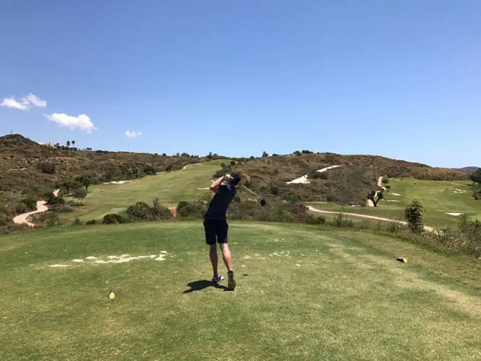 Golfer driving off the tee at La Cala resort in Spain