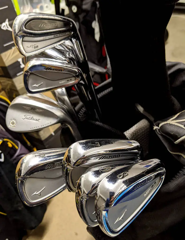 Mizuno MP64 golf irons in a golf bag