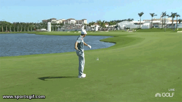Rory Mcilroy throwing a club into the water 