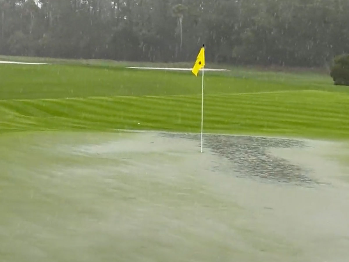 Rain flooding the green at one of the holes at TPC Sawgrass